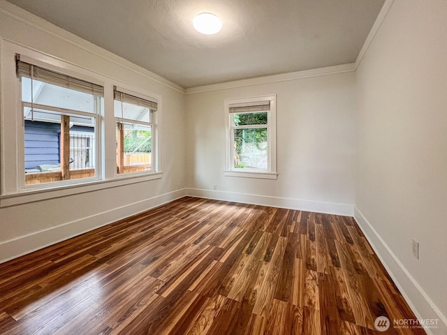 1915 Dexter Ave N, Seattle, WA 98109 - spare room with dark wood-style flooring, crown molding, baseboards, and healthy amount of natural light