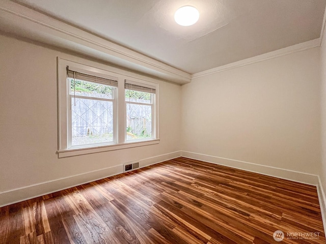 1915 Dexter Ave N, Seattle, WA 98109 - unfurnished room with baseboards, dark wood-style flooring, and ornamental molding