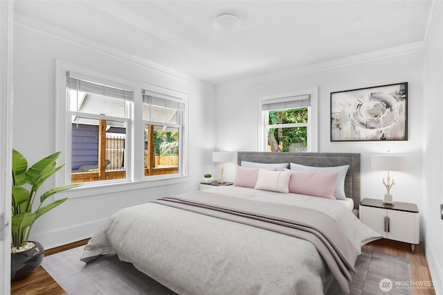 1915 Dexter Ave N, Seattle, WA 98109 - bedroom with wood finished floors and ornamental molding