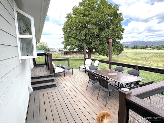 54 Jaquish Rd, Omak, WA 98841 - wooden terrace featuring outdoor dining space, a yard, and a mountain view