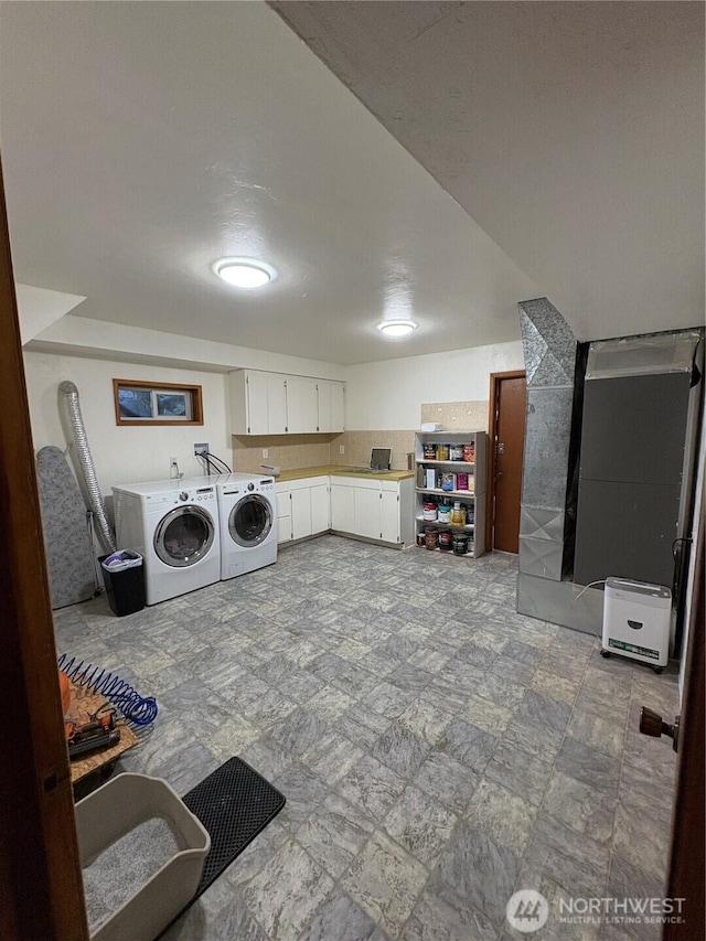 54 Jaquish Rd, Omak, WA 98841 - laundry room with independent washer and dryer and cabinet space