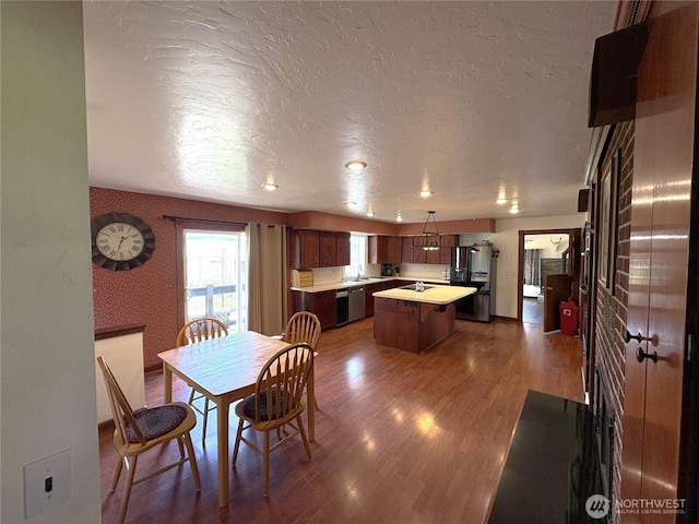 54 Jaquish Rd, Omak, WA 98841 - dining area with a textured ceiling and wood finished floors