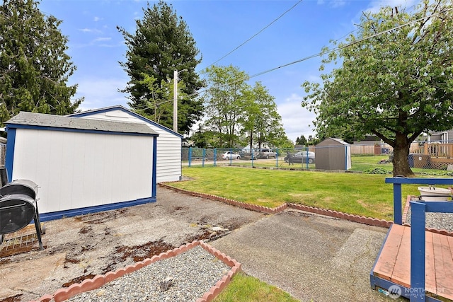 1811 S Sprague Ave, Tacoma, WA 98405 - view of yard with a storage shed, an outbuilding, and a patio