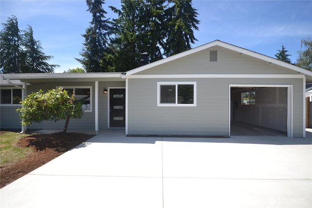 64 Queets St, Steilacoom, WA 98388 - ranch-style house featuring concrete driveway and an attached garage