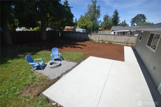64 Queets St, Steilacoom, WA 98388 - fenced backyard featuring a patio area and a fire pit