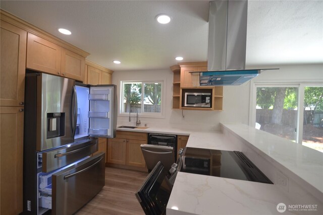 64 Queets St, Steilacoom, WA 98388 - kitchen with appliances with stainless steel finishes, island range hood, a sink, light stone countertops, and wood finished floors