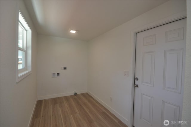 64 Queets St, Steilacoom, WA 98388 - laundry area with electric dryer hookup, wood finished floors, baseboards, and washer hookup