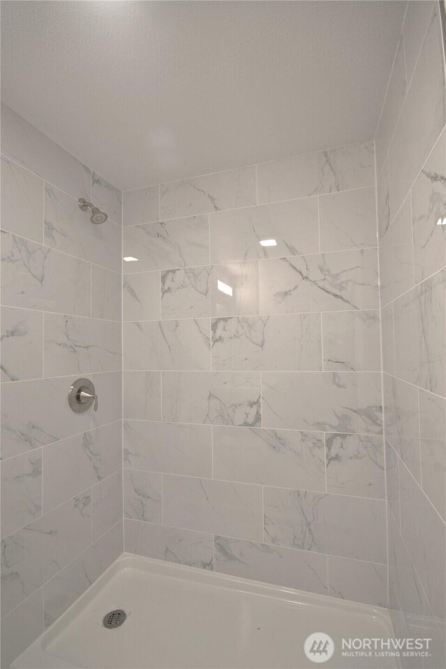 64 Queets St, Steilacoom, WA 98388 - bathroom featuring tiled shower