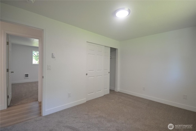 64 Queets St, Steilacoom, WA 98388 - unfurnished bedroom with carpet, baseboards, and a closet