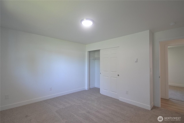 64 Queets St, Steilacoom, WA 98388 - unfurnished bedroom featuring light colored carpet, a closet, and baseboards