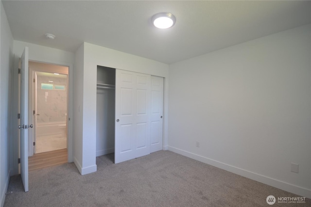 64 Queets St, Steilacoom, WA 98388 - unfurnished bedroom featuring carpet floors, a closet, and baseboards