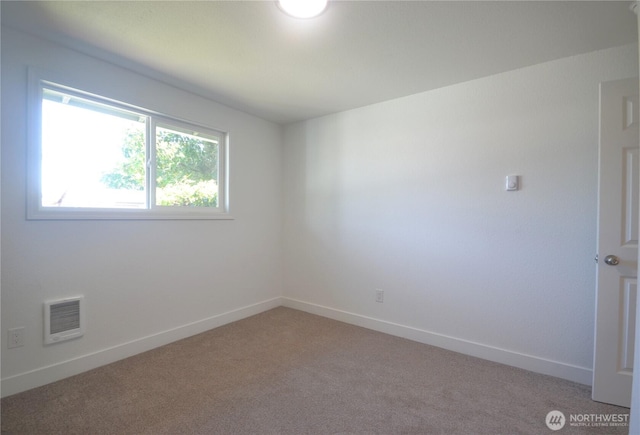 64 Queets St, Steilacoom, WA 98388 - spare room with light carpet, baseboards, and heating unit