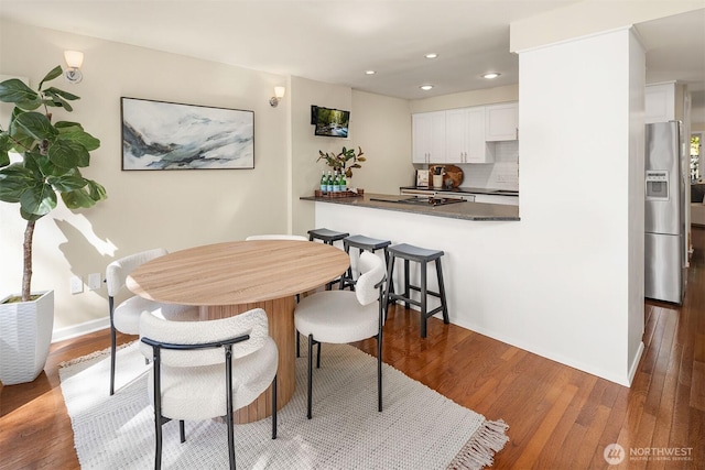 2345 42nd Ave E, Seattle, WA 98112 - dining room featuring wood finished floors, recessed lighting, and baseboards