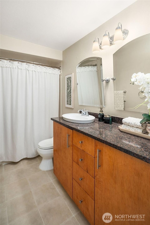 2345 42nd Ave E, Seattle, WA 98112 - full bath with vanity, toilet, and tile patterned floors
