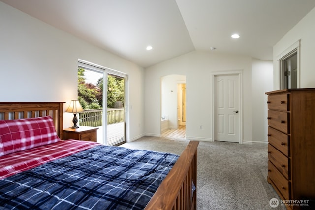 carpeted bedroom with access to outside, lofted ceiling, arched walkways, baseboards, and recessed lighting