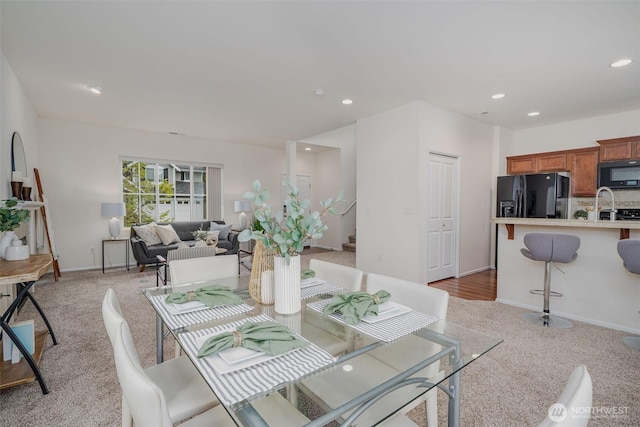 27815 NE 148th Ln, Duvall, WA 98019 - dining area with light colored carpet, recessed lighting, stairway, and baseboards
