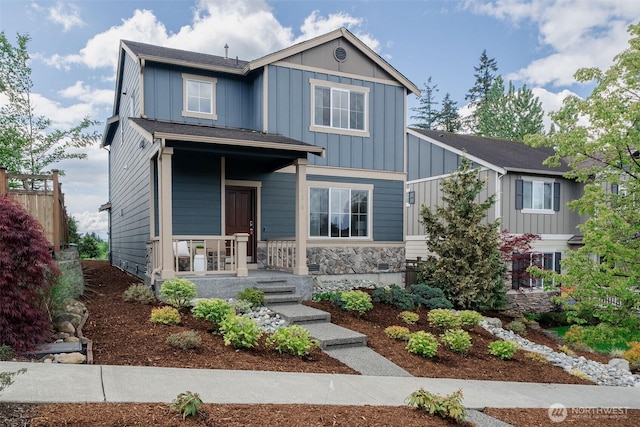 27815 NE 148th Ln, Duvall, WA 98019 - view of front of property featuring board and batten siding, covered porch, and stone siding