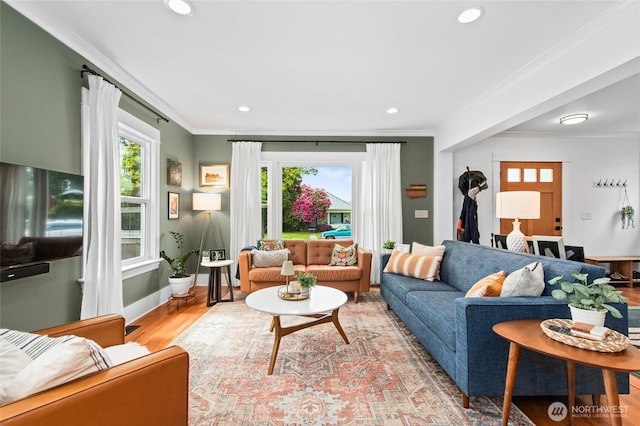 living area with crown molding, light wood finished floors, recessed lighting, and baseboards