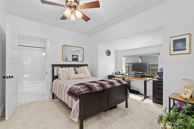 bedroom featuring ornamental molding, light colored carpet, a desk, ensuite bathroom, and ceiling fan