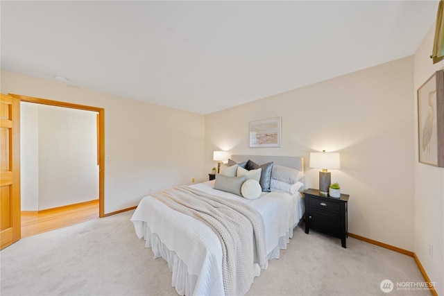 bedroom featuring carpet flooring and baseboards