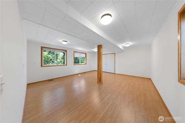 basement featuring light wood-style floors