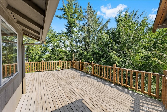deck with view of scattered trees