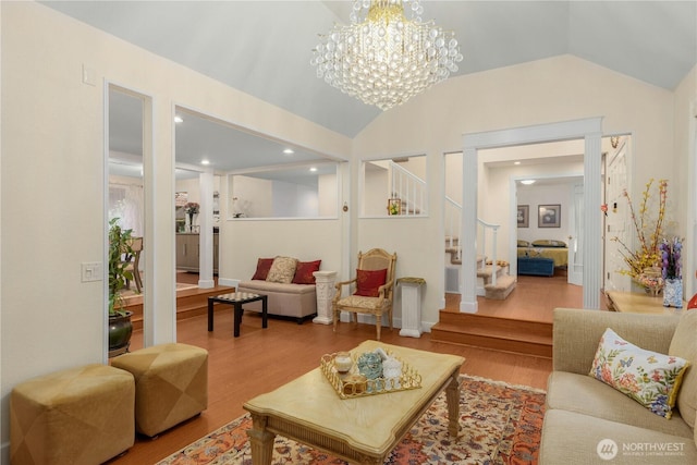 21842 NE 30th Pl, Sammamish, WA 98074 - living area with wood finished floors, vaulted ceiling, a chandelier, stairway, and recessed lighting