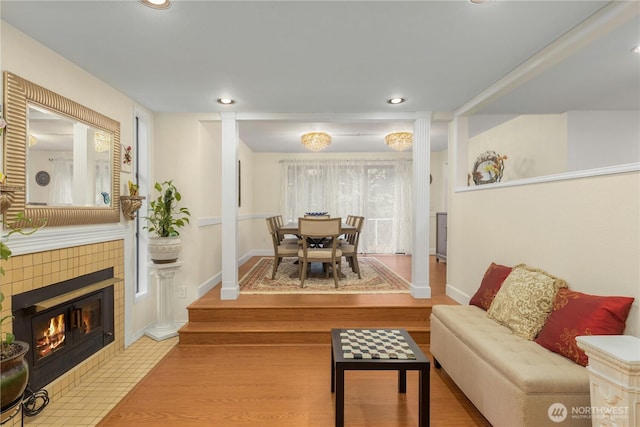 21842 NE 30th Pl, Sammamish, WA 98074 - living area featuring recessed lighting, a tile fireplace, and wood finished floors