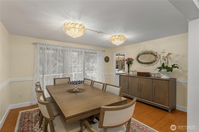 21842 NE 30th Pl, Sammamish, WA 98074 - dining room with light wood-style floors and a chandelier