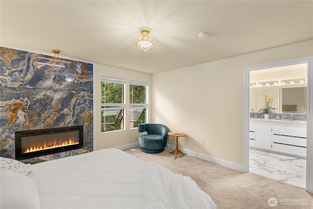 21842 NE 30th Pl, Sammamish, WA 98074 - carpeted bedroom featuring a stone fireplace, a chandelier, and ensuite bathroom
