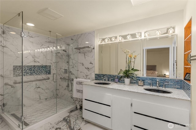 21842 NE 30th Pl, Sammamish, WA 98074 - bathroom with marble finish floors, a marble finish shower, double vanity, recessed lighting, and backsplash