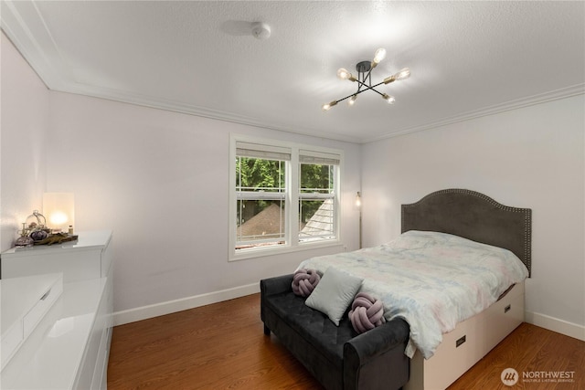 21842 NE 30th Pl, Sammamish, WA 98074 - bedroom with a chandelier, crown molding, and wood finished floors