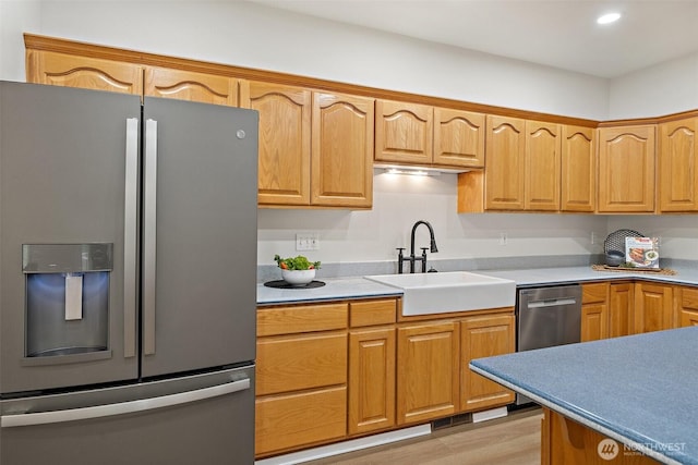 13212 Wicks End Ln SW, Port Orchard, WA 98367 - kitchen with stainless steel refrigerator with ice dispenser, a sink, light wood-type flooring, light countertops, and recessed lighting