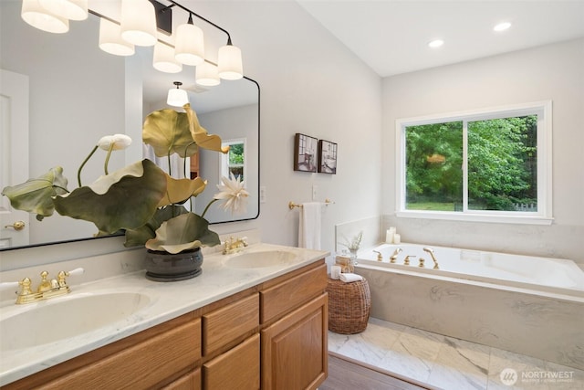 13212 Wicks End Ln SW, Port Orchard, WA 98367 - bathroom with a bath, double vanity, and recessed lighting