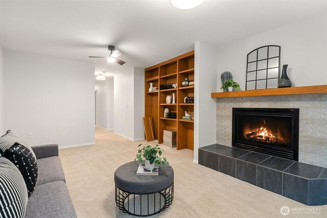 13212 Wicks End Ln SW, Port Orchard, WA 98367 - living area with a fireplace, carpet flooring, ceiling fan, and baseboards