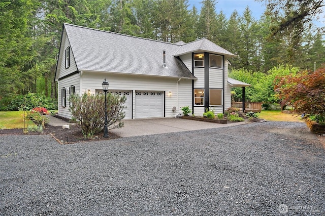 13212 Wicks End Ln SW, Port Orchard, WA 98367 - view of front of home with driveway, a shingled roof, and a garage