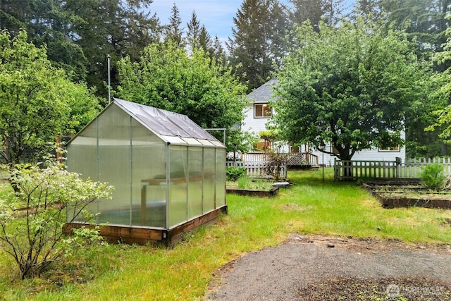 13212 Wicks End Ln SW, Port Orchard, WA 98367 - view of yard featuring an exterior structure, a vegetable garden, and an outdoor structure