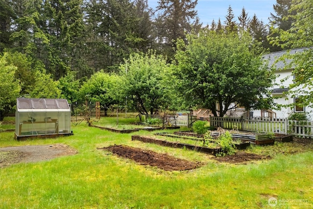 13212 Wicks End Ln SW, Port Orchard, WA 98367 - view of yard with a garden, a greenhouse, and an outdoor structure