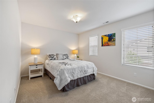 bedroom with carpet and baseboards