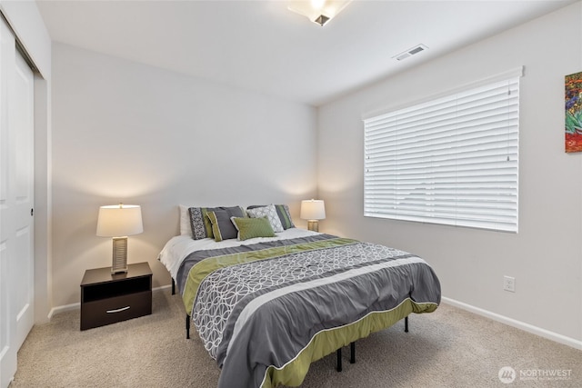 bedroom featuring carpet floors, baseboards, and a closet