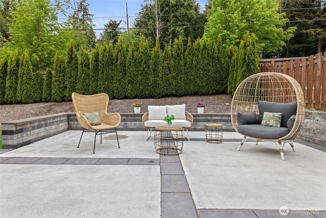 view of patio / terrace featuring fence