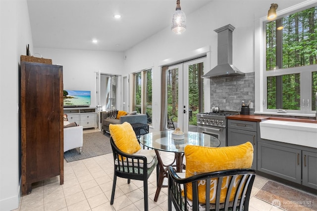 22717 Briarwood Ct SE, Yelm, WA 98597 - kitchen with high end stainless steel range oven, ventilation hood, gray cabinetry, recessed lighting, and decorative backsplash