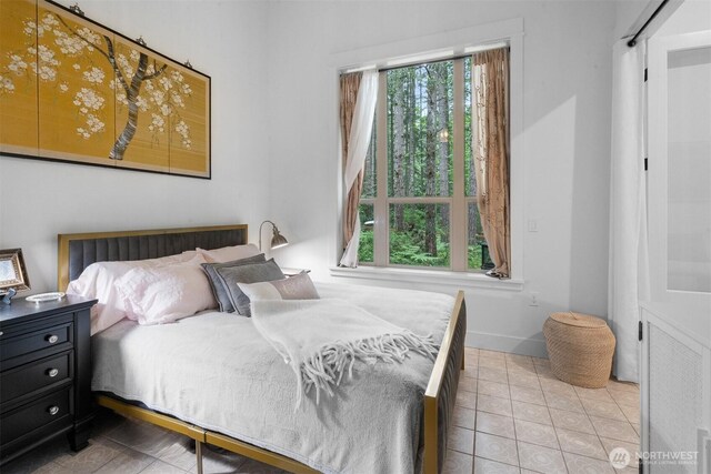 22717 Briarwood Ct SE, Yelm, WA 98597 - tiled bedroom featuring baseboards