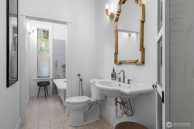 22717 Briarwood Ct SE, Yelm, WA 98597 - full bathroom with tile patterned flooring, a freestanding tub, baseboards, and toilet