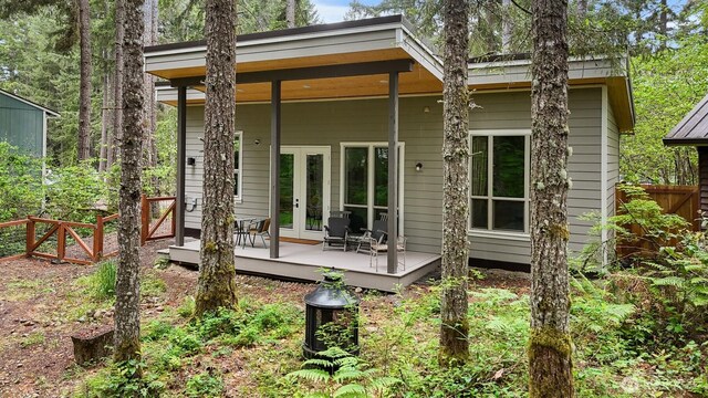 22717 Briarwood Ct SE, Yelm, WA 98597 - back of property with french doors, fence, and a deck