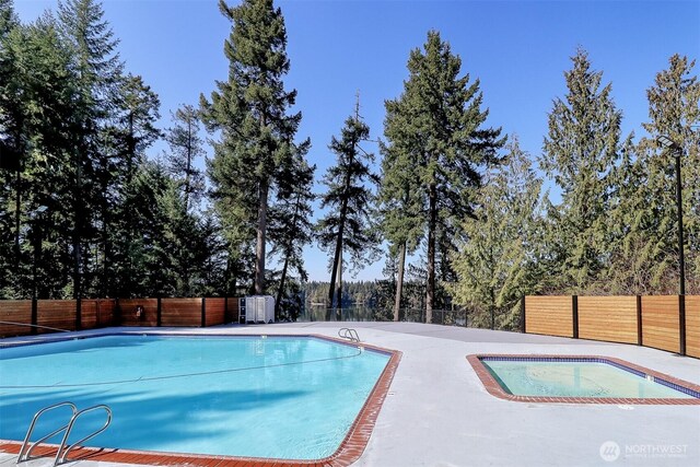 22717 Briarwood Ct SE, Yelm, WA 98597 - community pool with a fenced backyard and a patio