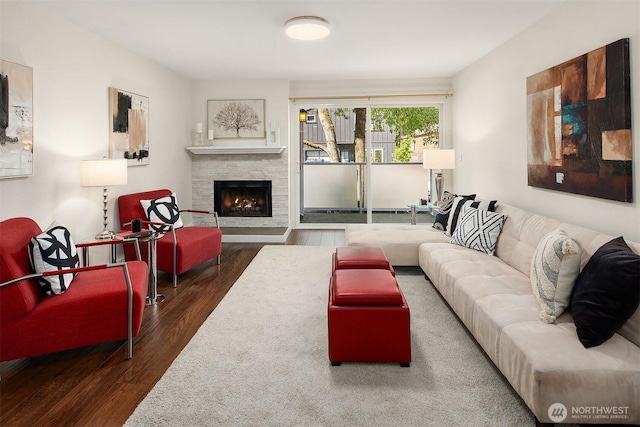 living room featuring wood finished floors and a fireplace