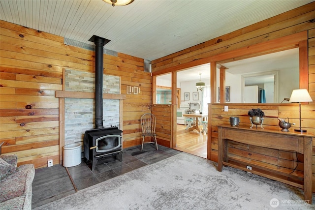 531 3rd St, Ronald, WA 98940 - living room featuring a wood stove and wood walls