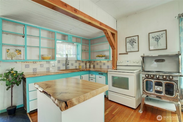 531 3rd St, Ronald, WA 98940 - kitchen featuring white electric range oven, a sink, open shelves, wooden counters, and a center island