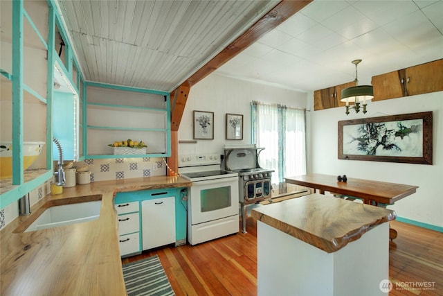 531 3rd St, Ronald, WA 98940 - kitchen with electric range, a sink, wooden counters, light wood finished floors, and pendant lighting